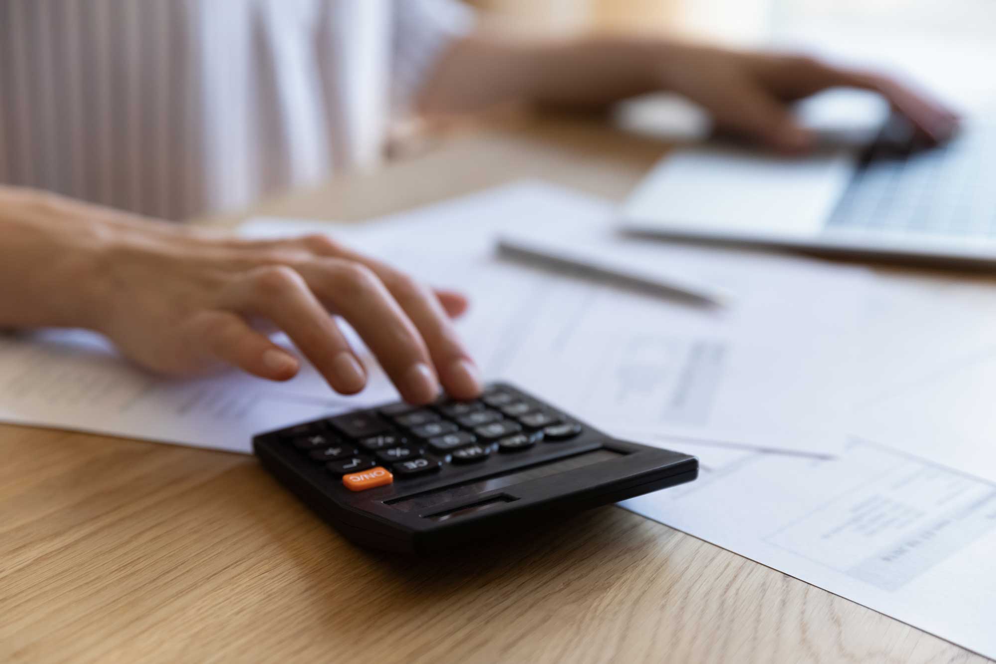 finance-professional-woman-using-calculator