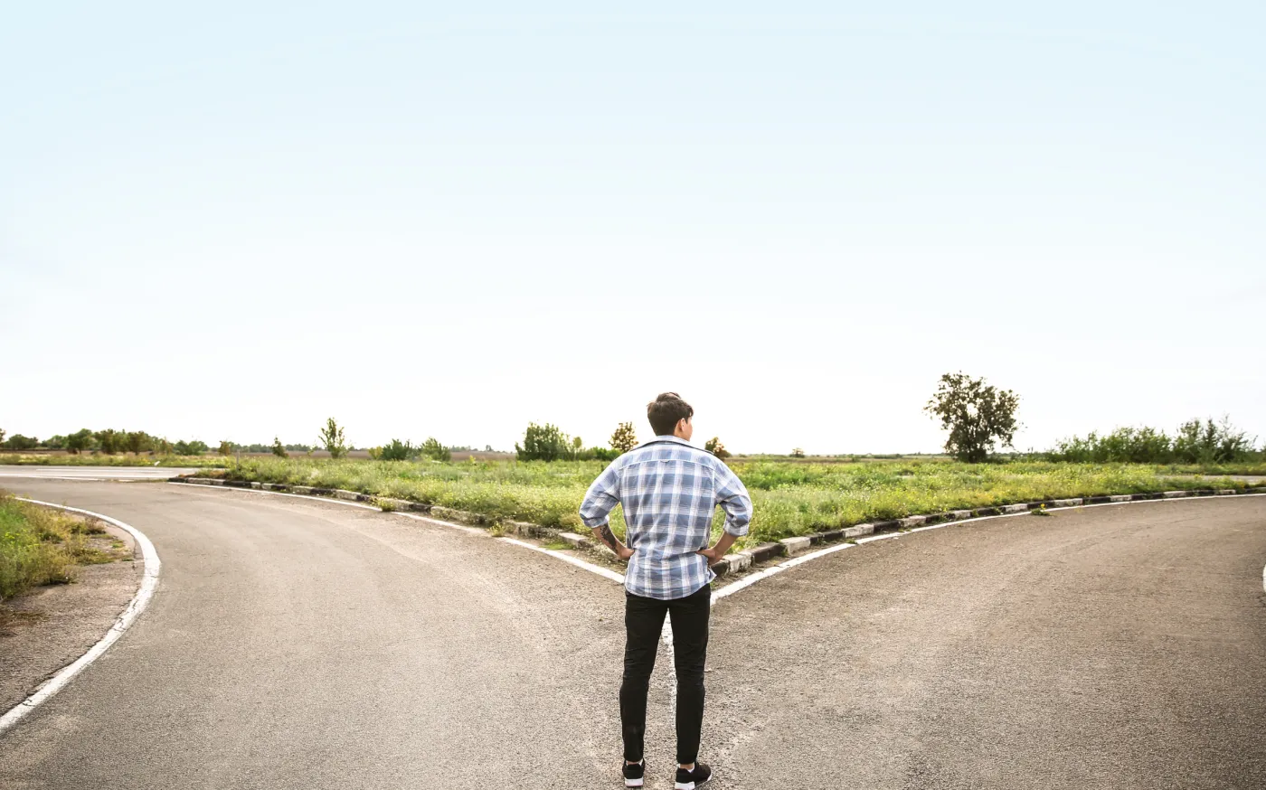 Man at a crossroads deciding which path to take